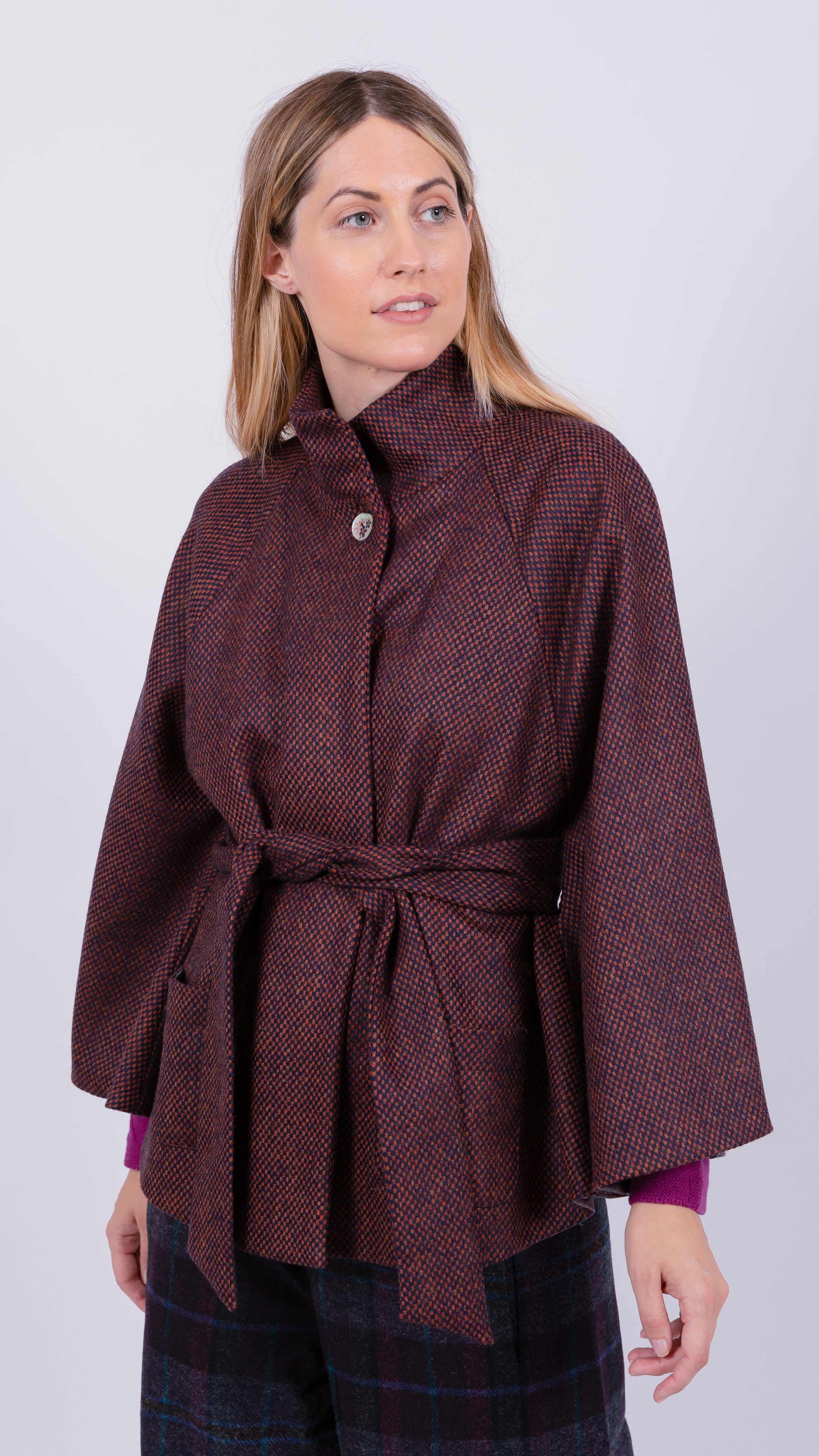 woman wearing VAAI burgundy wool cape coat
