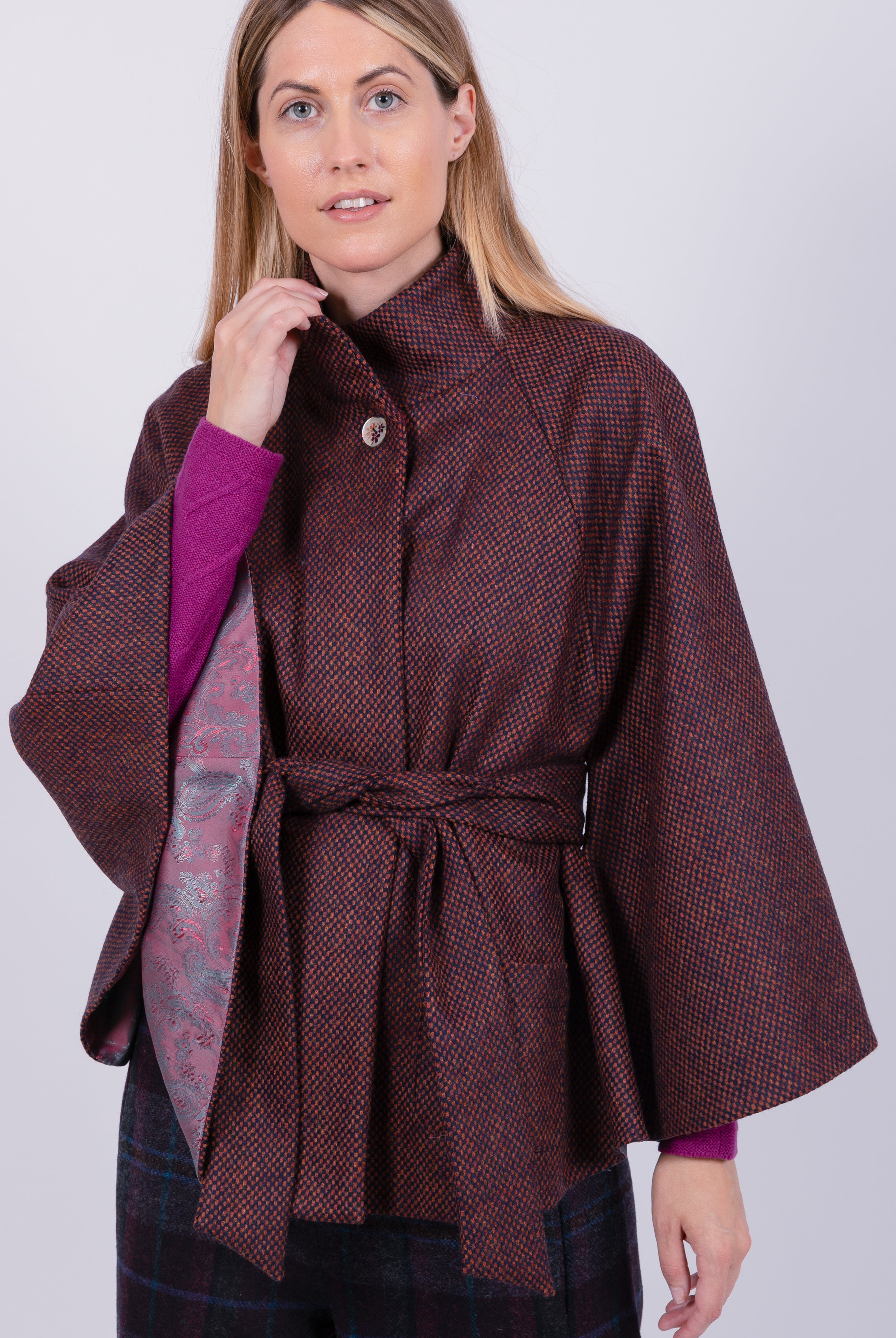 woman wearing VAAI burgundy wool cape coat