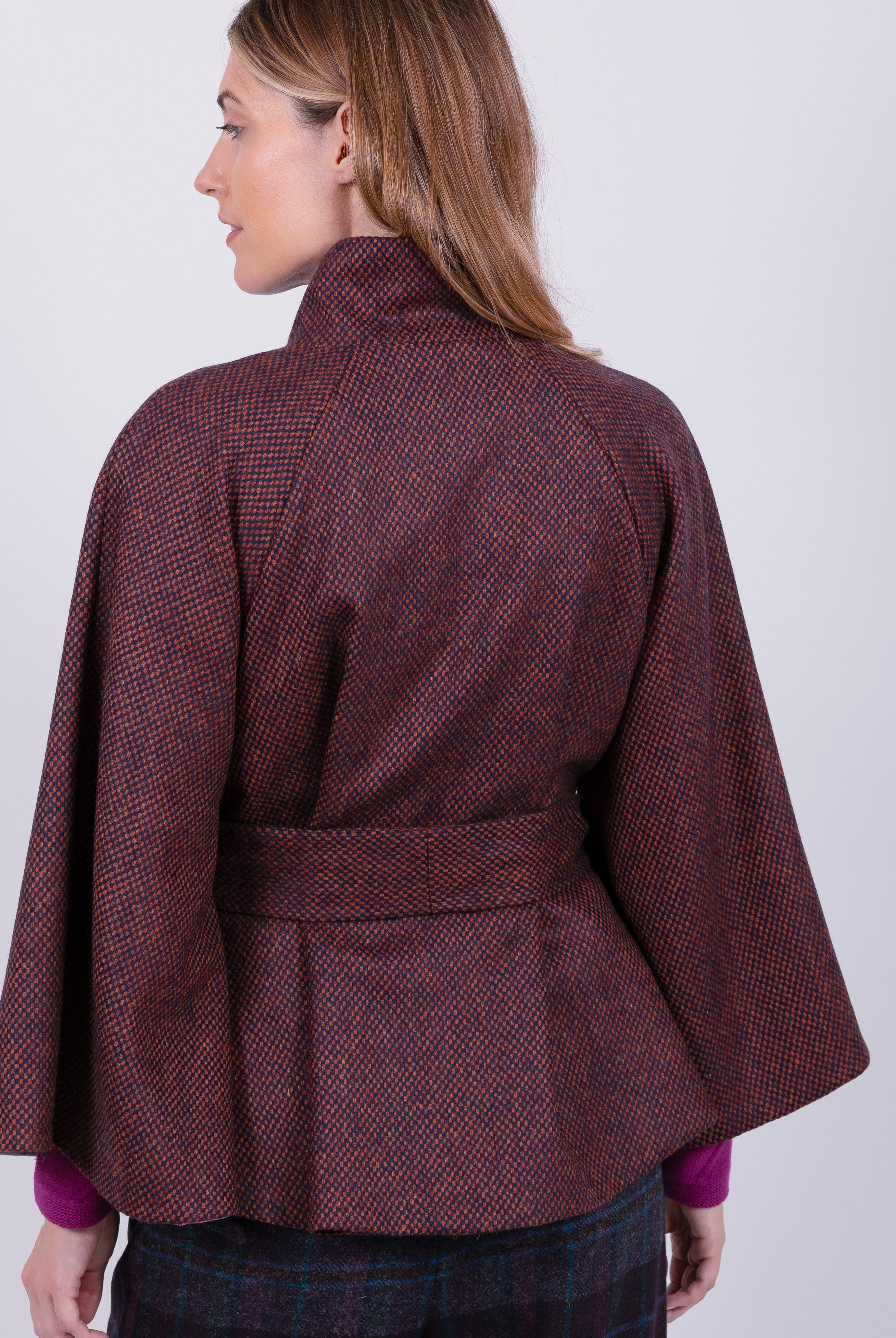 woman wearing VAAI burgundy wool cape coat