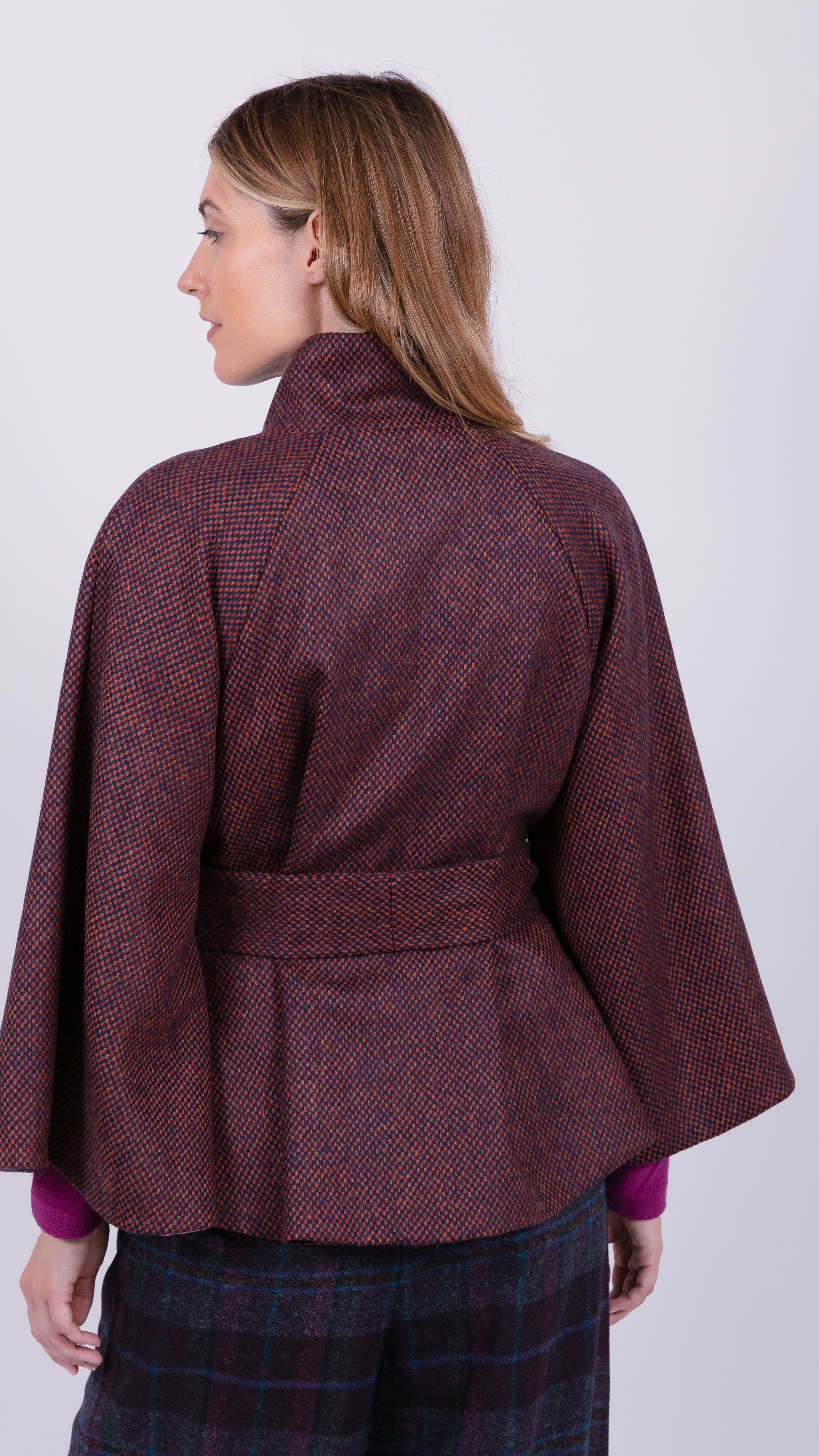 woman wearing VAAI burgundy wool cape coat