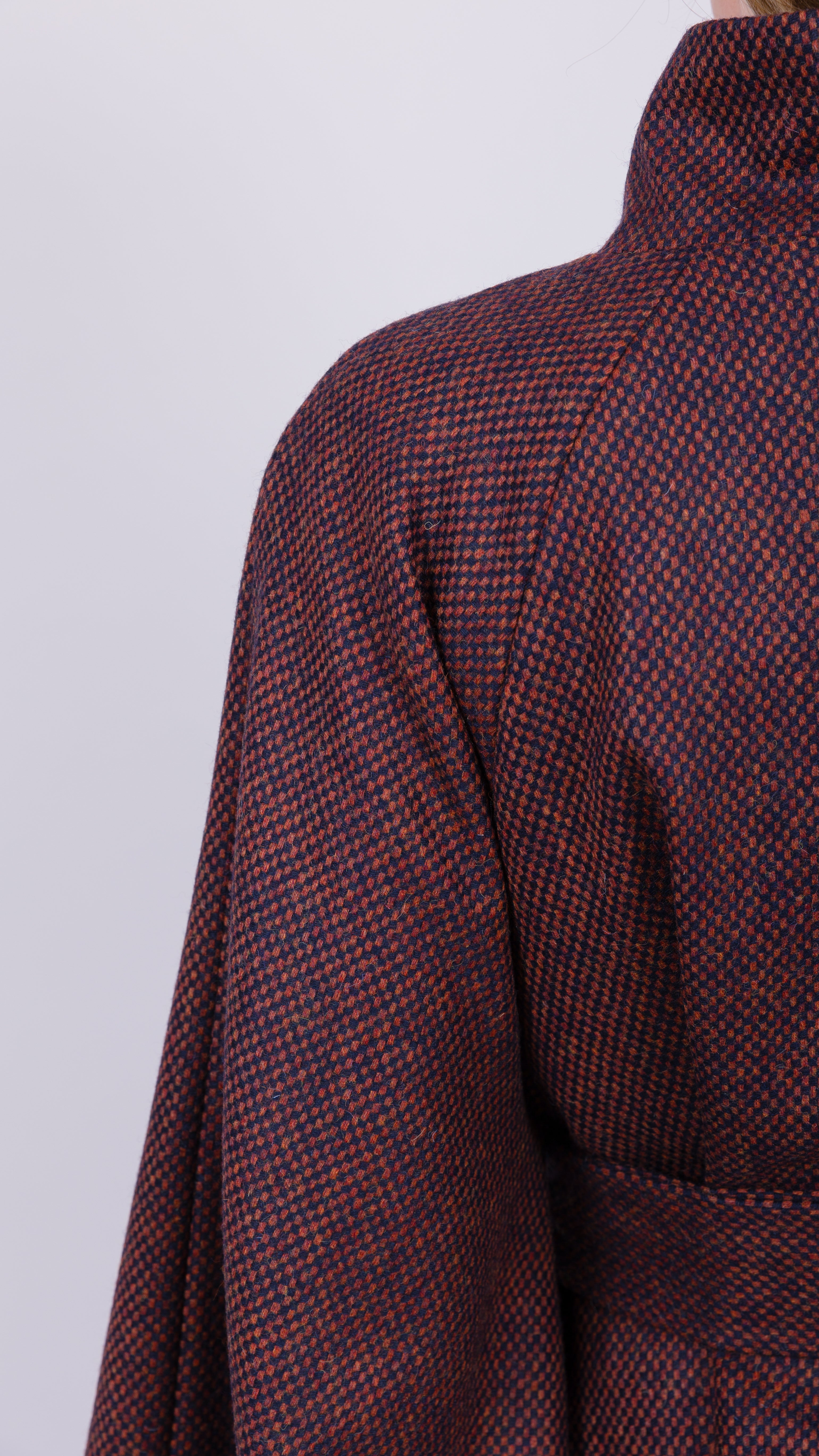 woman wearing VAAI burgundy wool cape coat