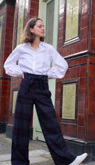 woman wearing VAAI belted checked british wool trousers