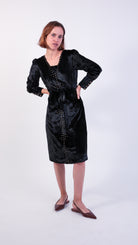 woman wearing VAAI black velvet dress with gold embroidery 