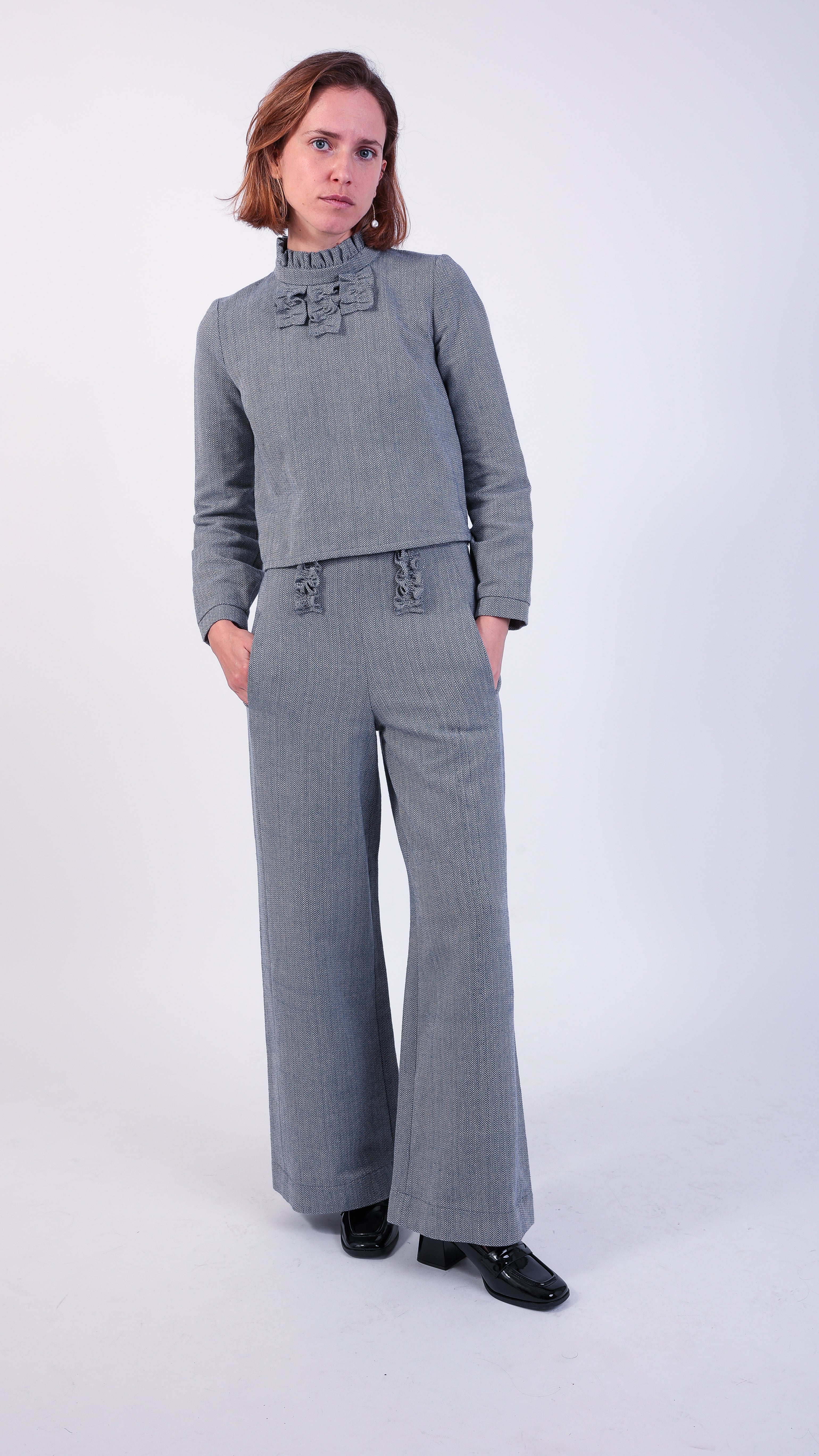 woman wearing VAAI blue herringbone coordinated set 