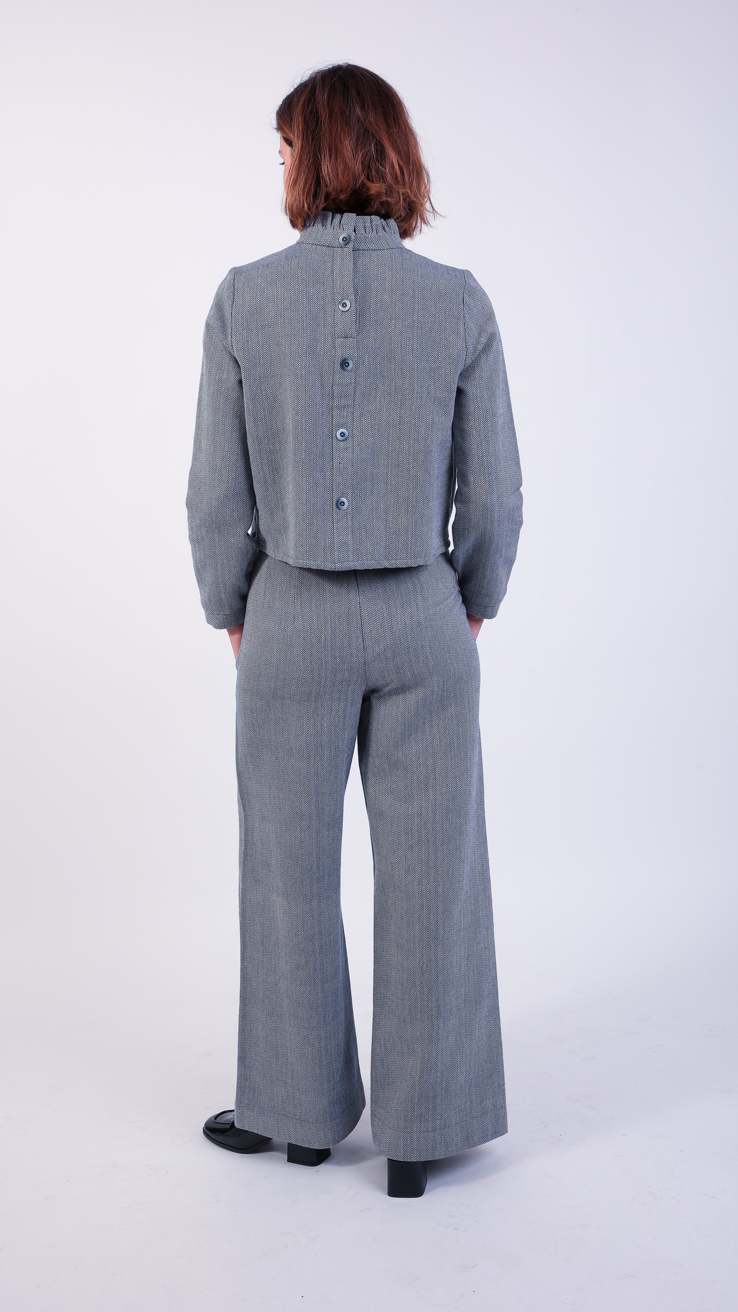 woman wearing VAAI blue herringbone coordinated set 