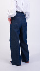 woman wearing VAAI high waisted tailored blue denim jeans