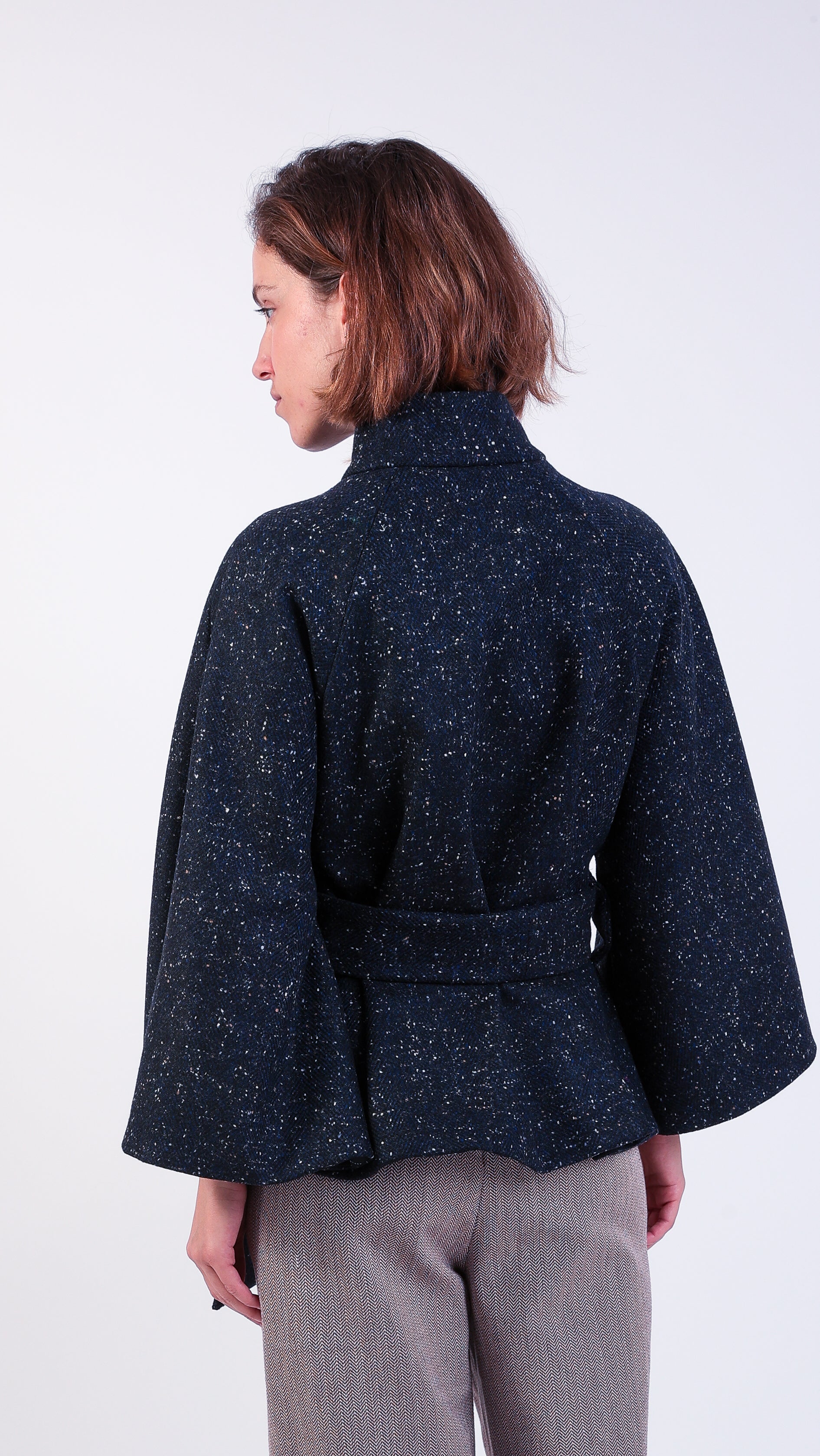 woman wearing VAAI scallop detail wool cape coat