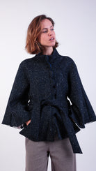 woman wearing VAAI scallop detail wool cape coat