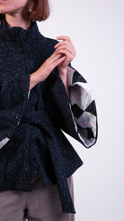 woman wearing VAAI scallop detail wool cape coat