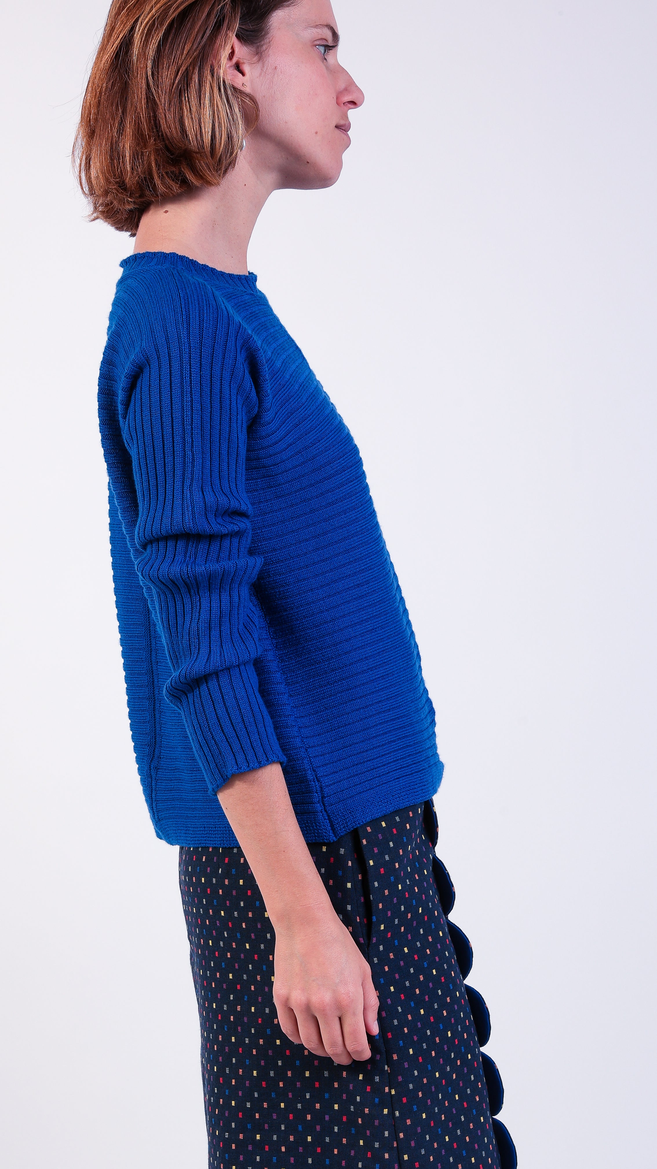 woman wearing VAAI blue ribbed wool jumper