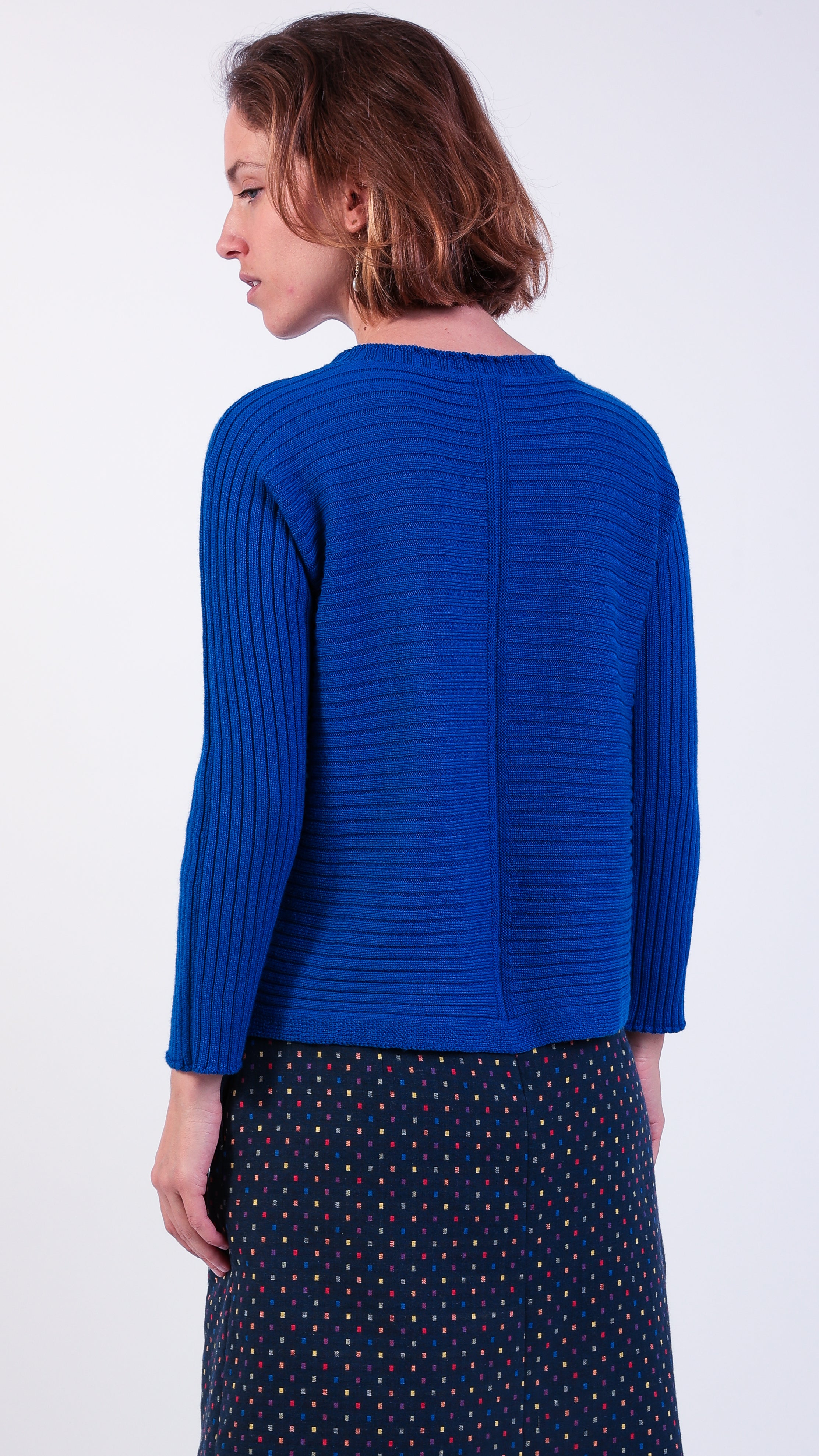 woman wearing VAAI blue ribbed wool jumper