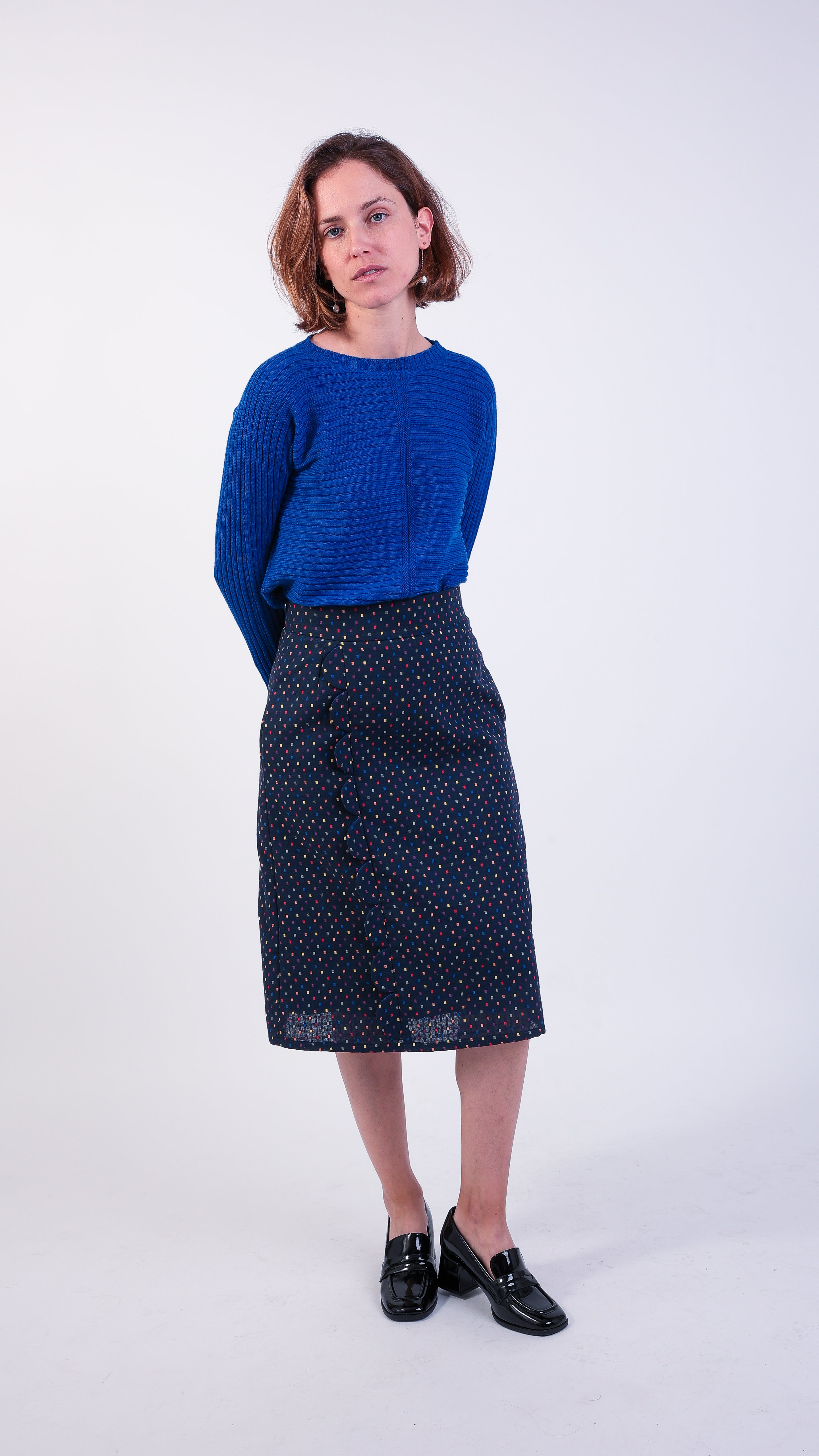 woman wearing VAAI blue ribbed wool jumper