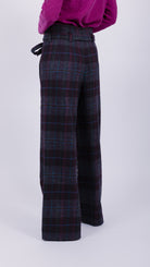 woman wearing VAAI belted checked british wool trousers