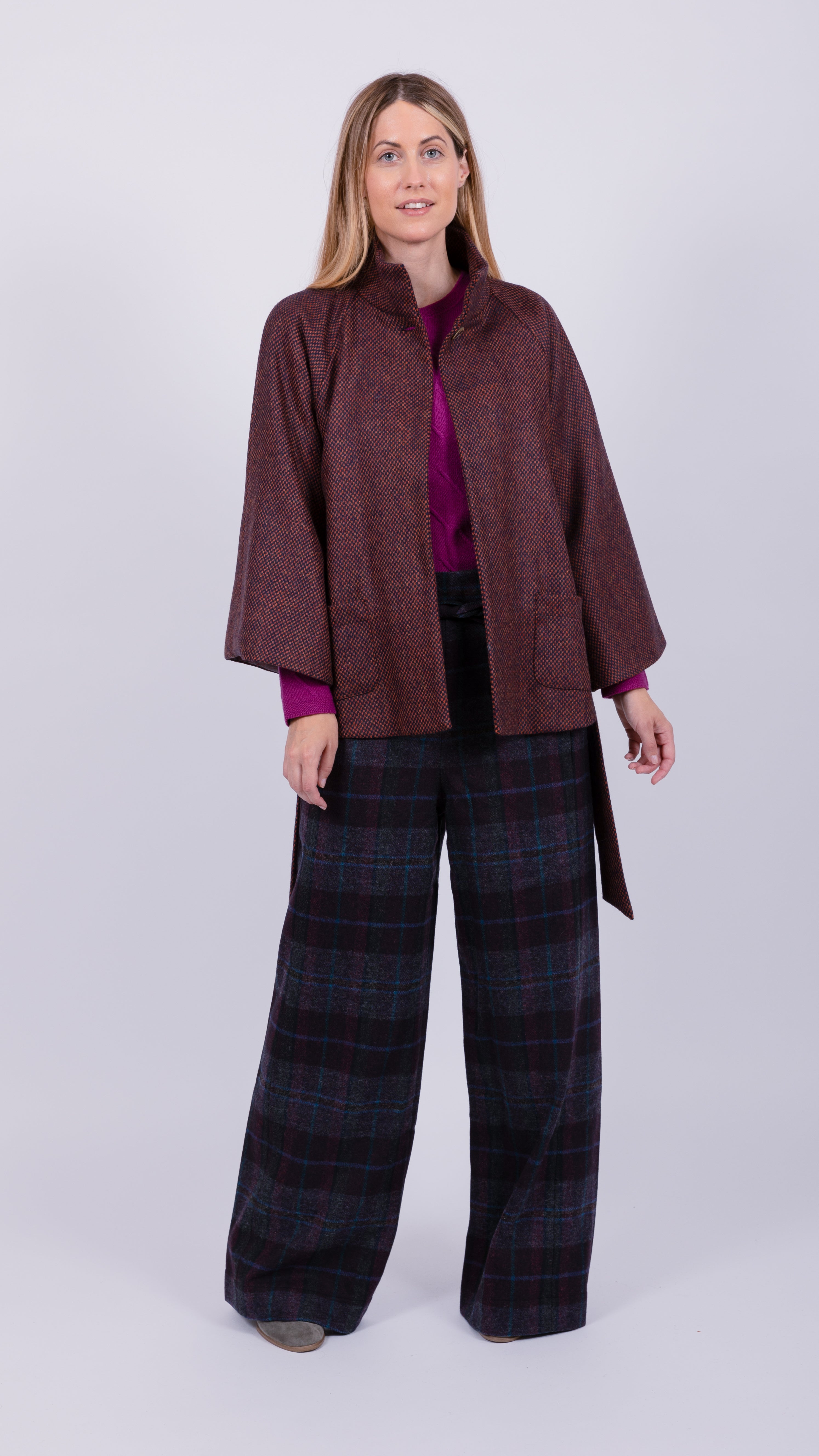 woman wearing VAAI burgundy wool cape coat