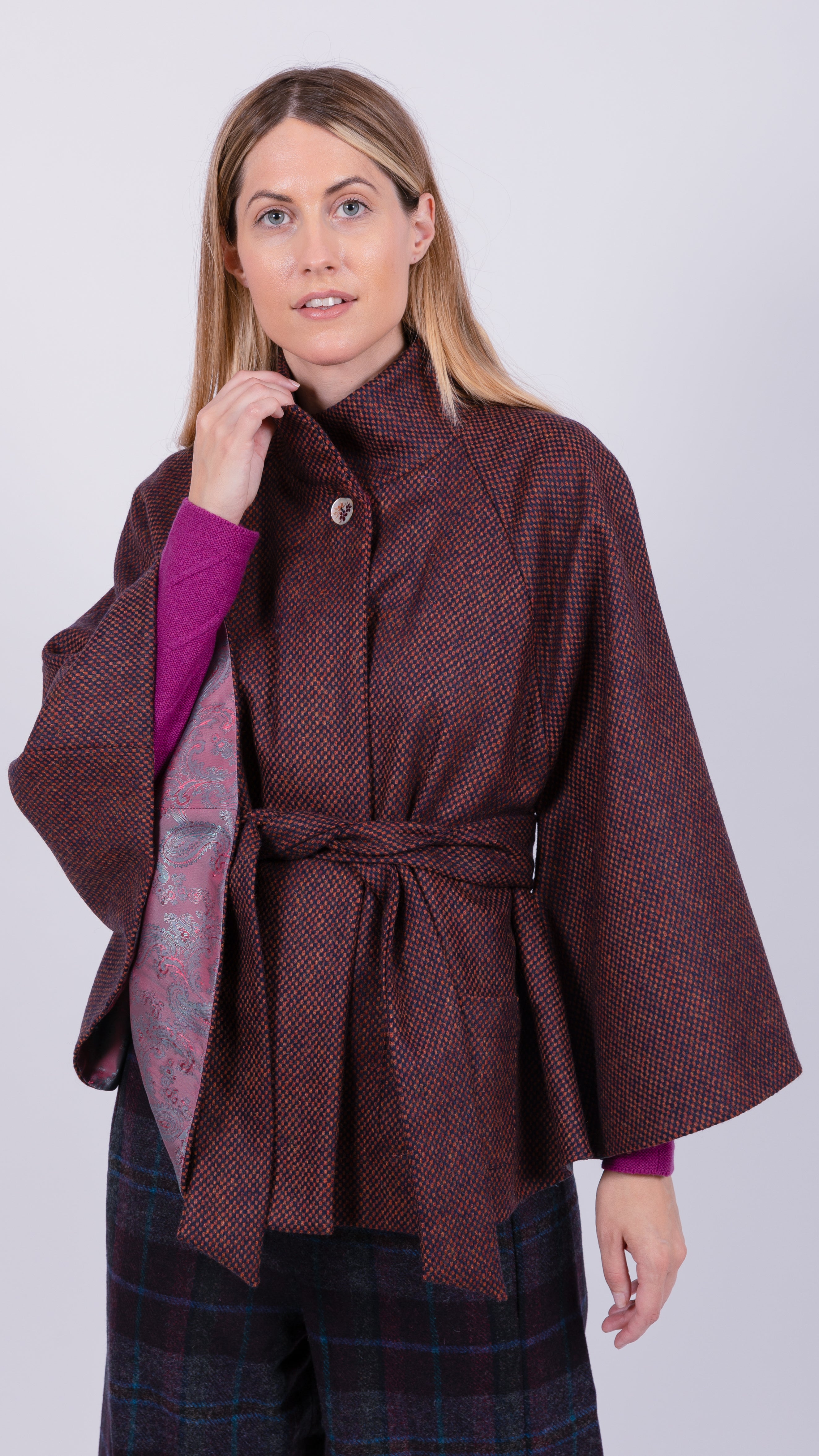 woman wearing VAAI burgundy wool cape coat