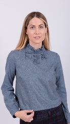 woman wearing VAAI speckled silk ruffle top