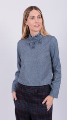 woman wearing VAAI speckled silk ruffle top