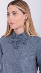 woman wearing VAAI speckled silk ruffle top