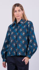 woman wearing floral print shirt