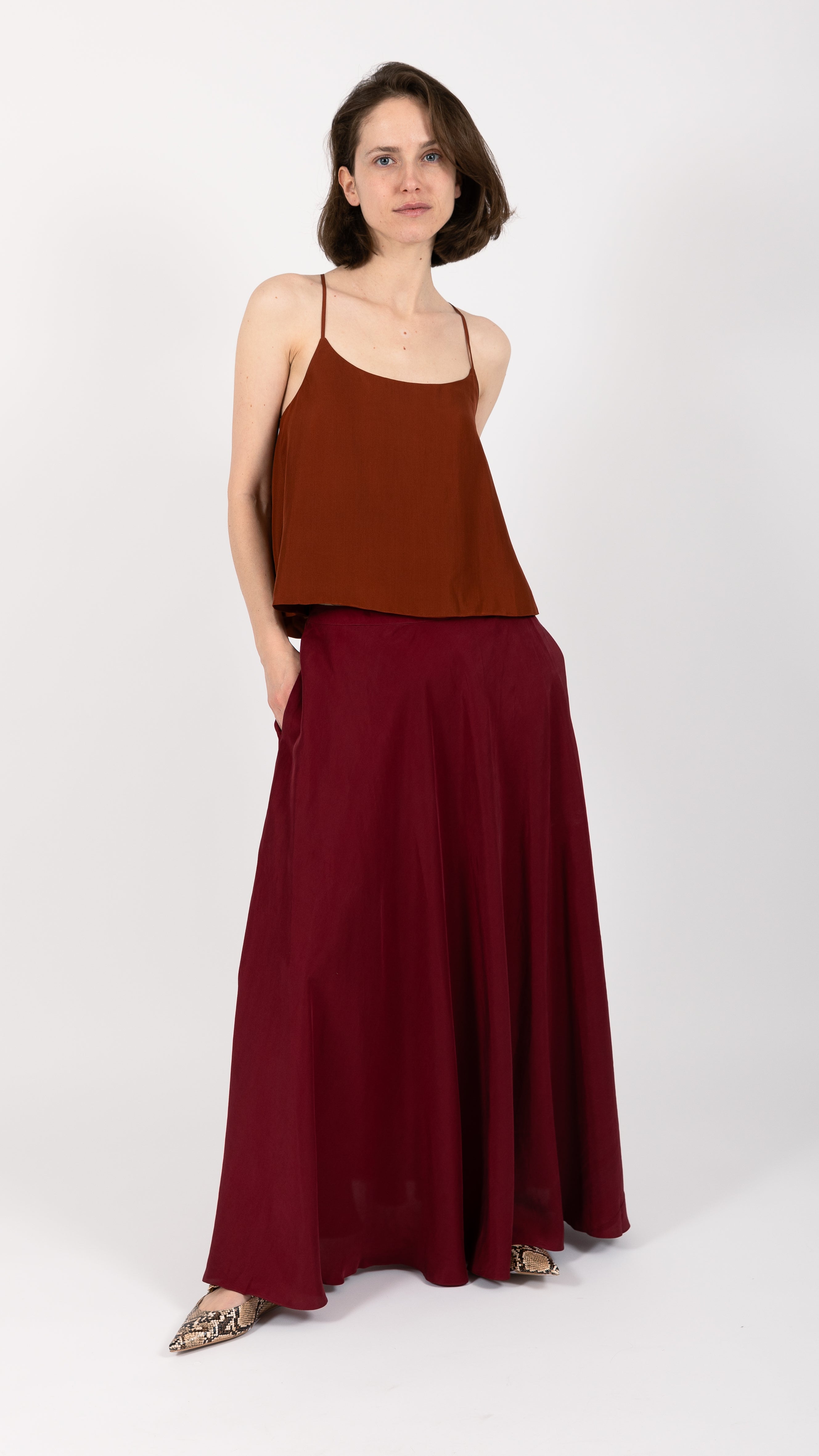 woman wearing VAAI burgundy silk maxi skirt