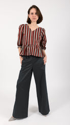 woman wearing VAAI striped cotton peplum top