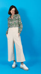 woman wearing VAAI ivory cropped needlecord high waisted trousers